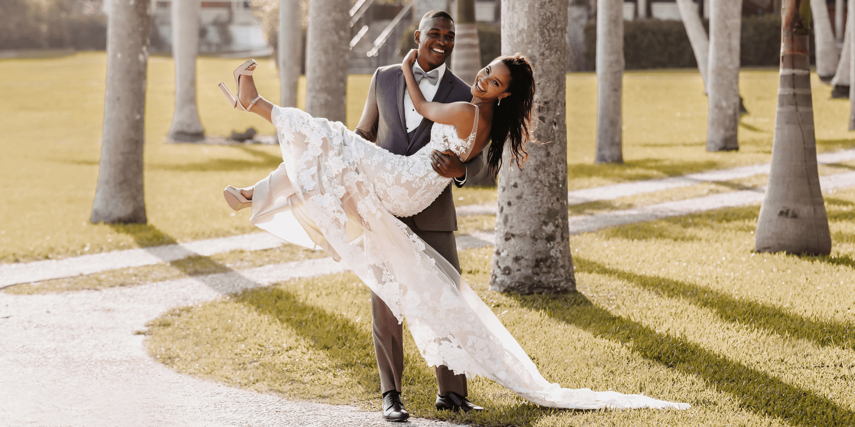 Сouple wearing a white gown and a gray suit