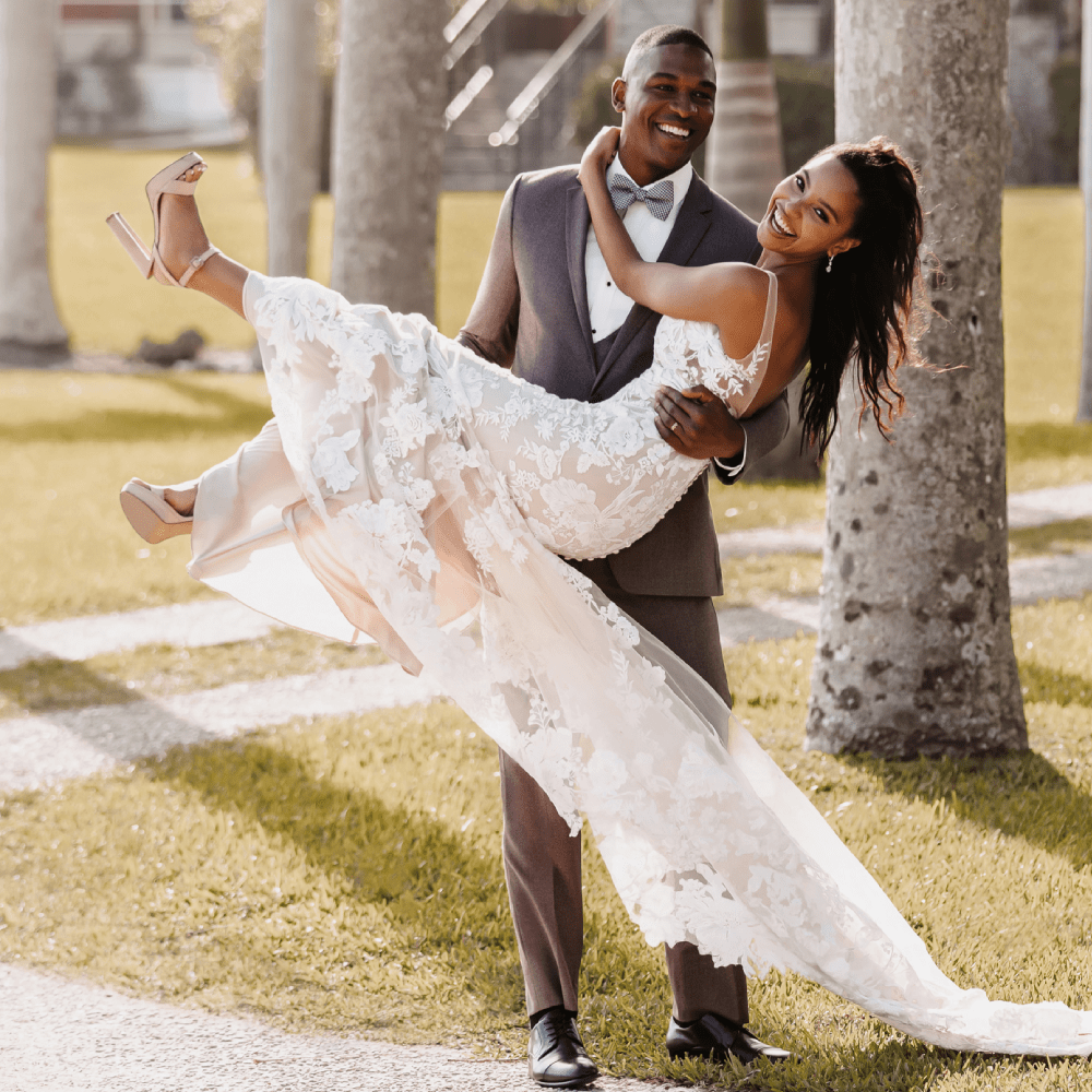 Сouple wearing a white gown and a gray suit